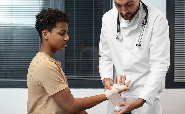 American Medical Center - Doctor providing medical care to a patient, engaging in a consultation in a well-lit clinic setting